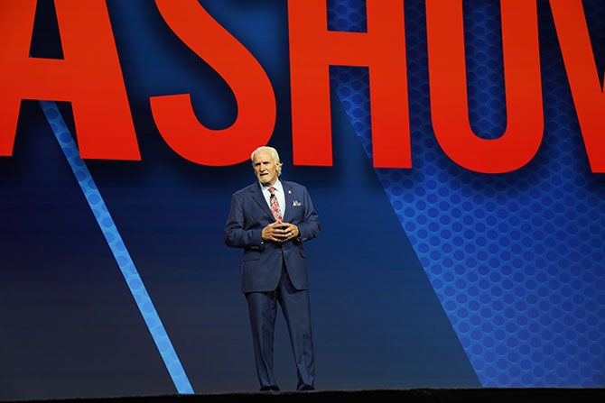 Michael Joe Cannon in suit and tie on stage